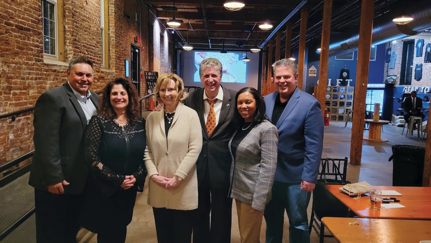 PARTY PEOPLE: Gov. Dan McKee and First Lady Susan McKee are joined by Johnston Democratic Committee Chairman Richard DelFino and his wife Deborah of Johnston, Lt. Gov. Sabina Matos and her husband Patrick Ward during last week’s unique networking night inside The Guild Brewery Pawtucket.
